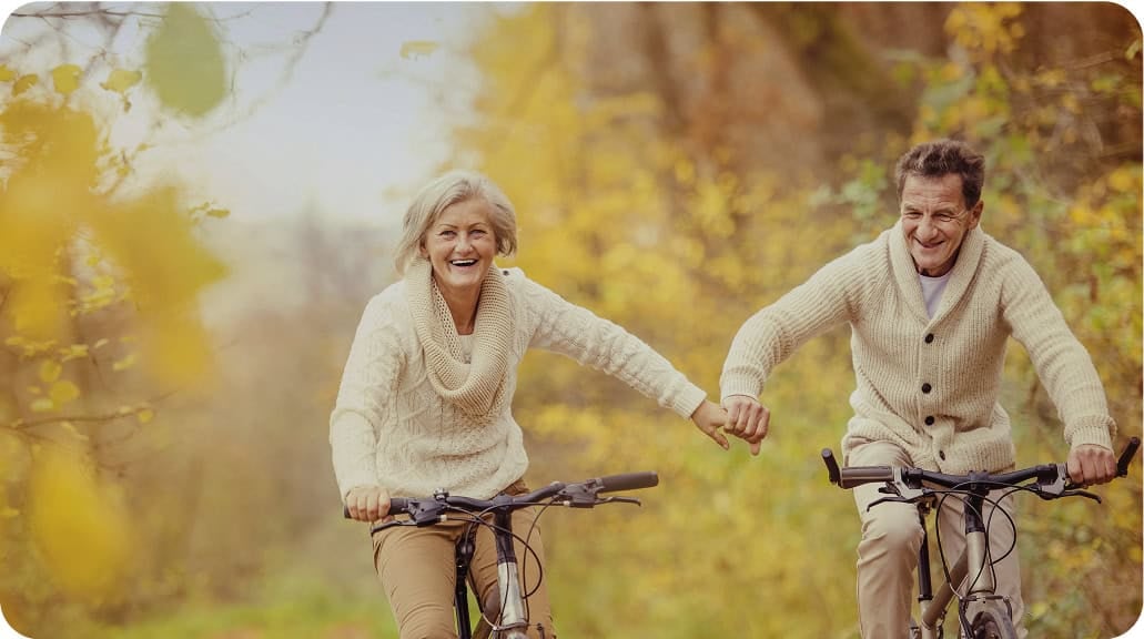 elder couple riding bikes