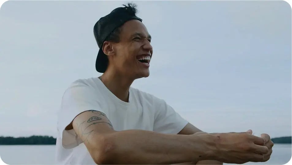 happy man sitting laughing