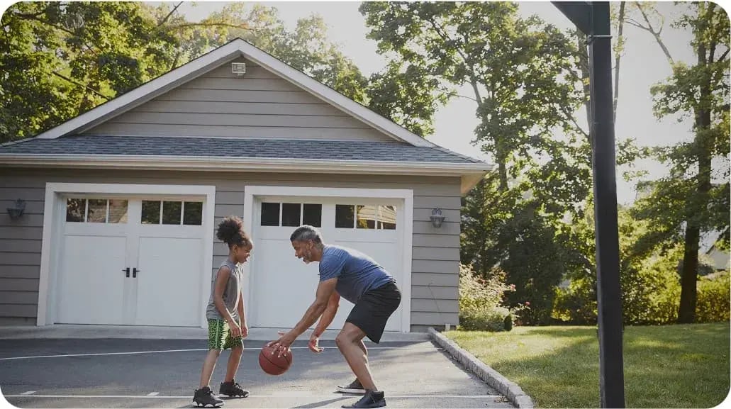 man playing basketball with kid