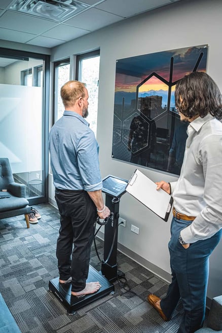 man undergoing body composition scan health assessment