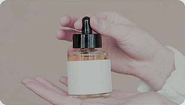woman holding therapy bottle