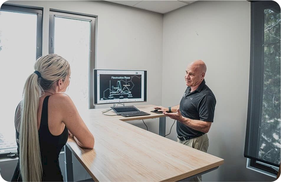 woman looking at results at computer