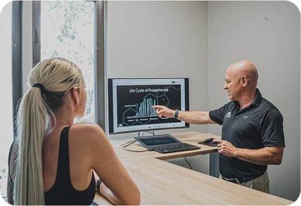 man showing results on screen