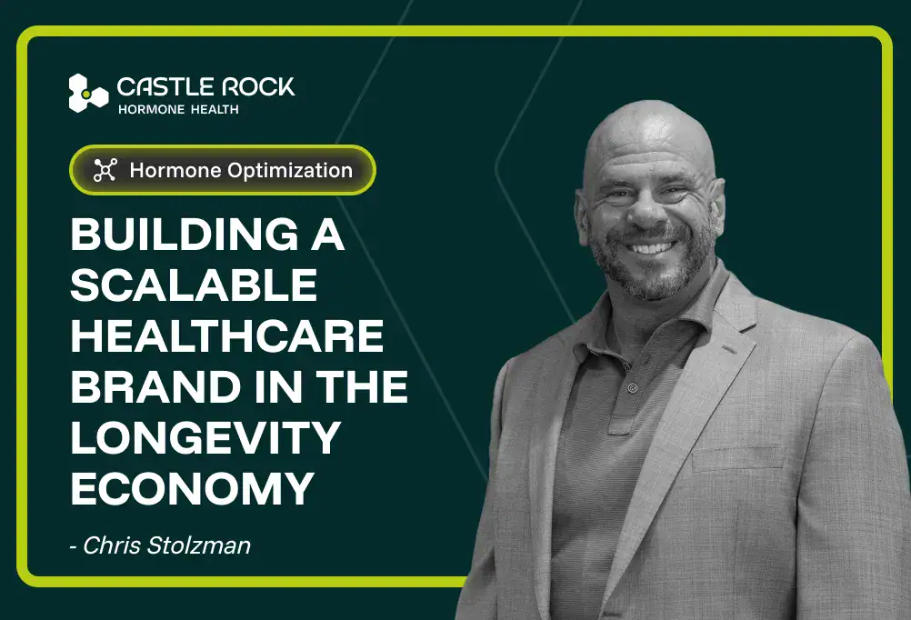 A smiling bald man in a suit stands next to text: Building a scalable healthcare brand in the longevity economy - Chris Stolzman. Castle Rock Hormone Health and Hormone Optimization are also displayed.